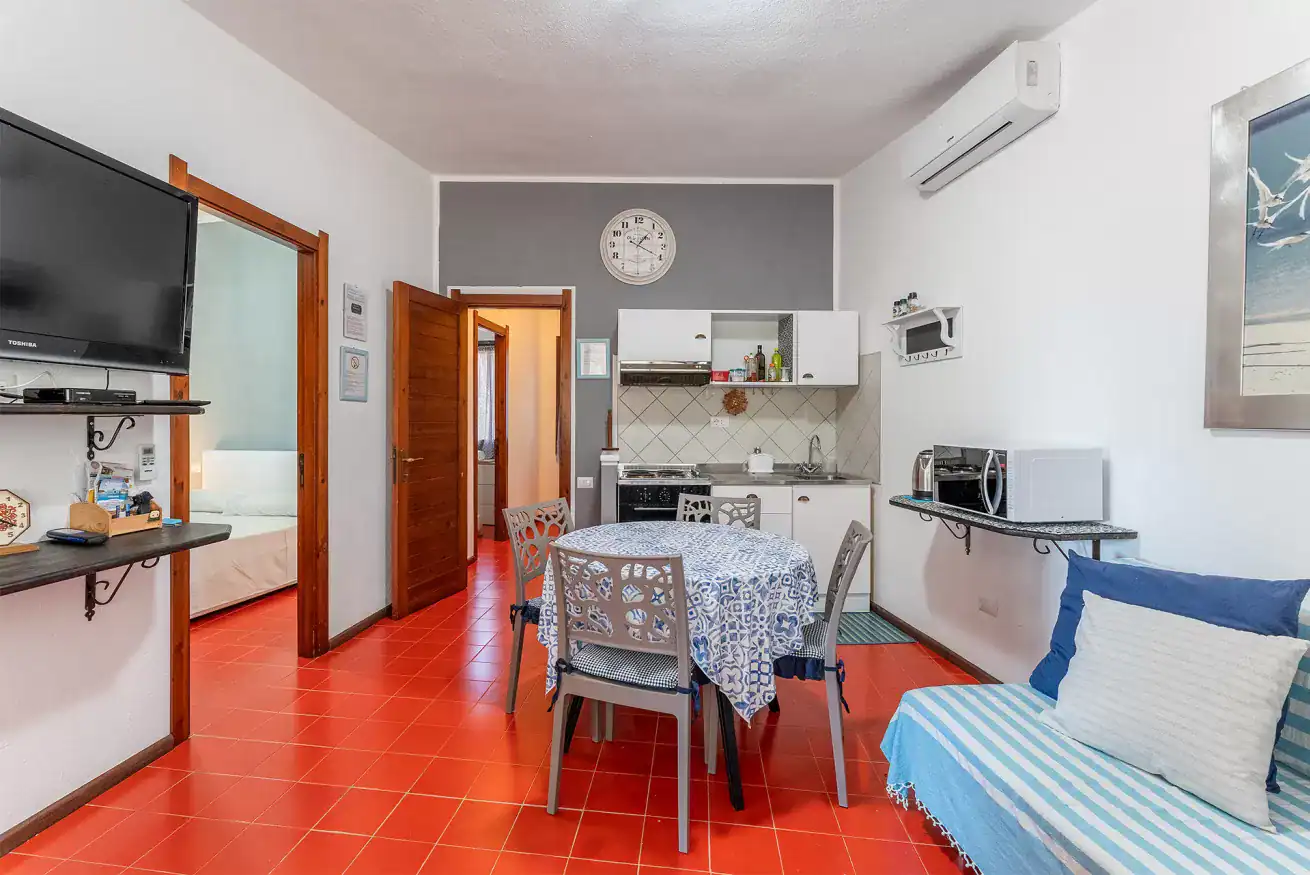 the interior of a flat with a kitchen and a table