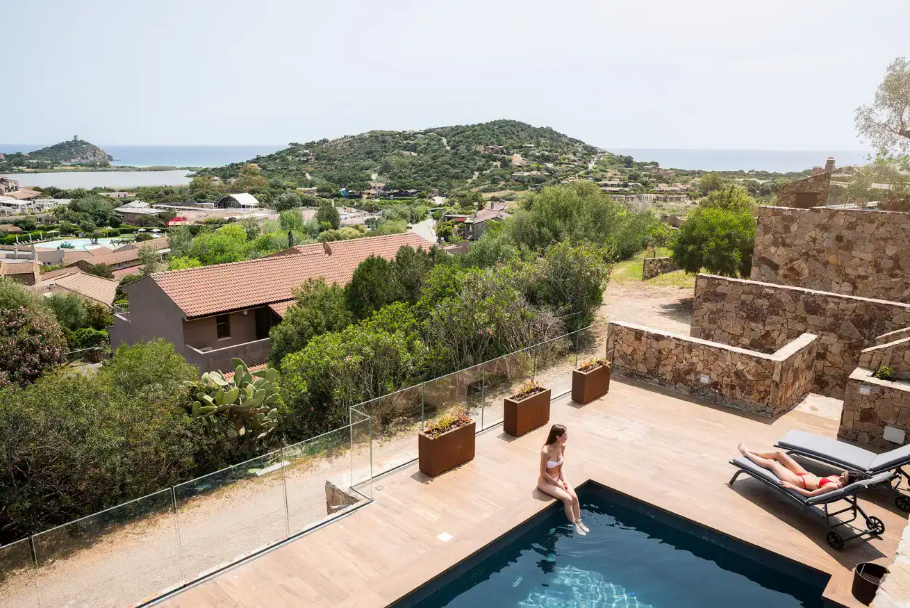 two women by the pool with a panoramic view