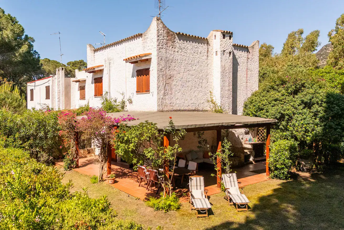 house with a garden and a shaded patio