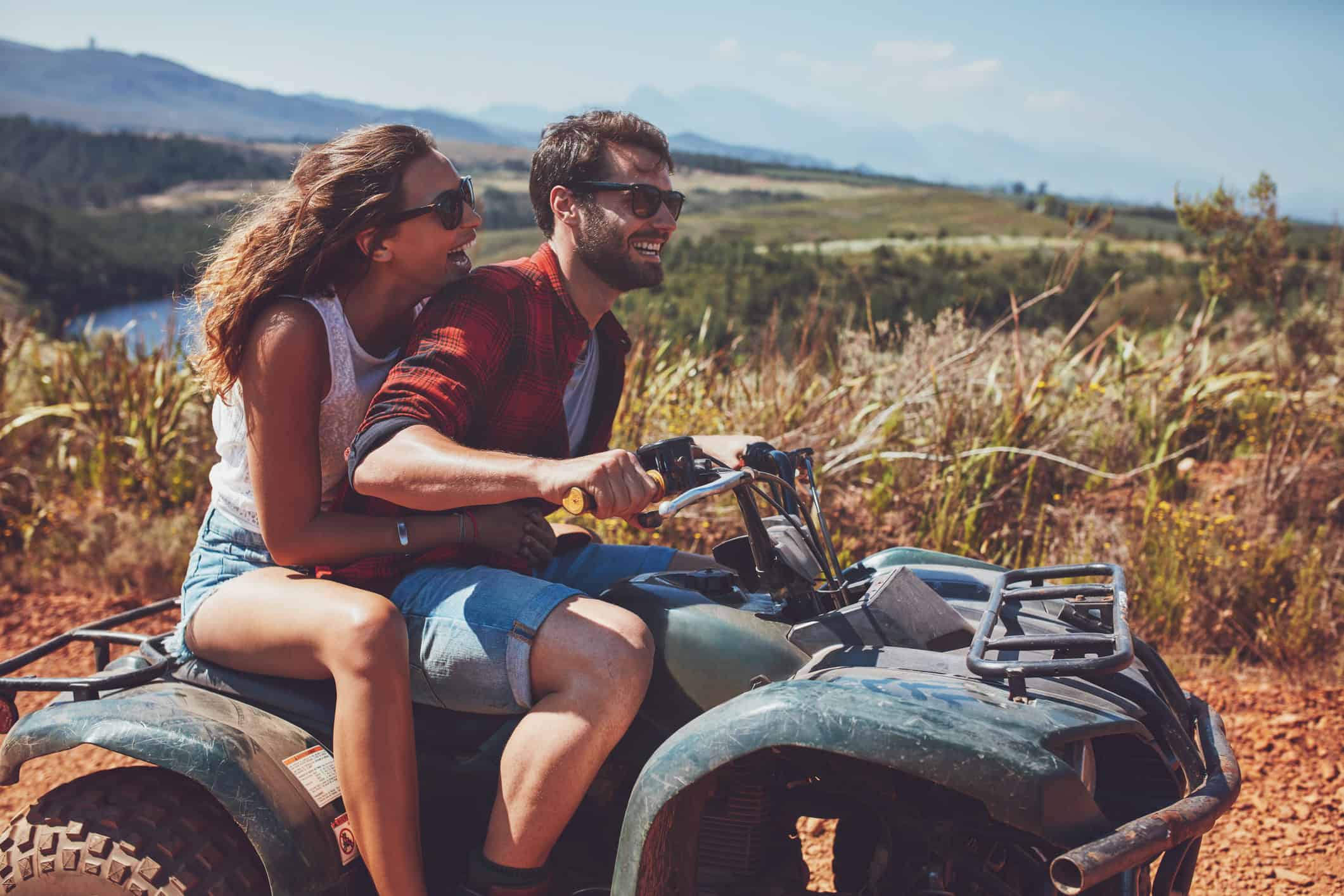 smiling couple enjoying an outdoor adventure